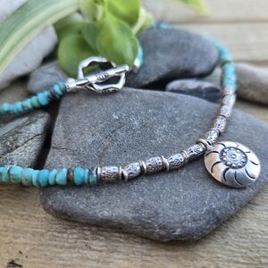 Turquoise Bead Necklace with Silver Sun Medallion